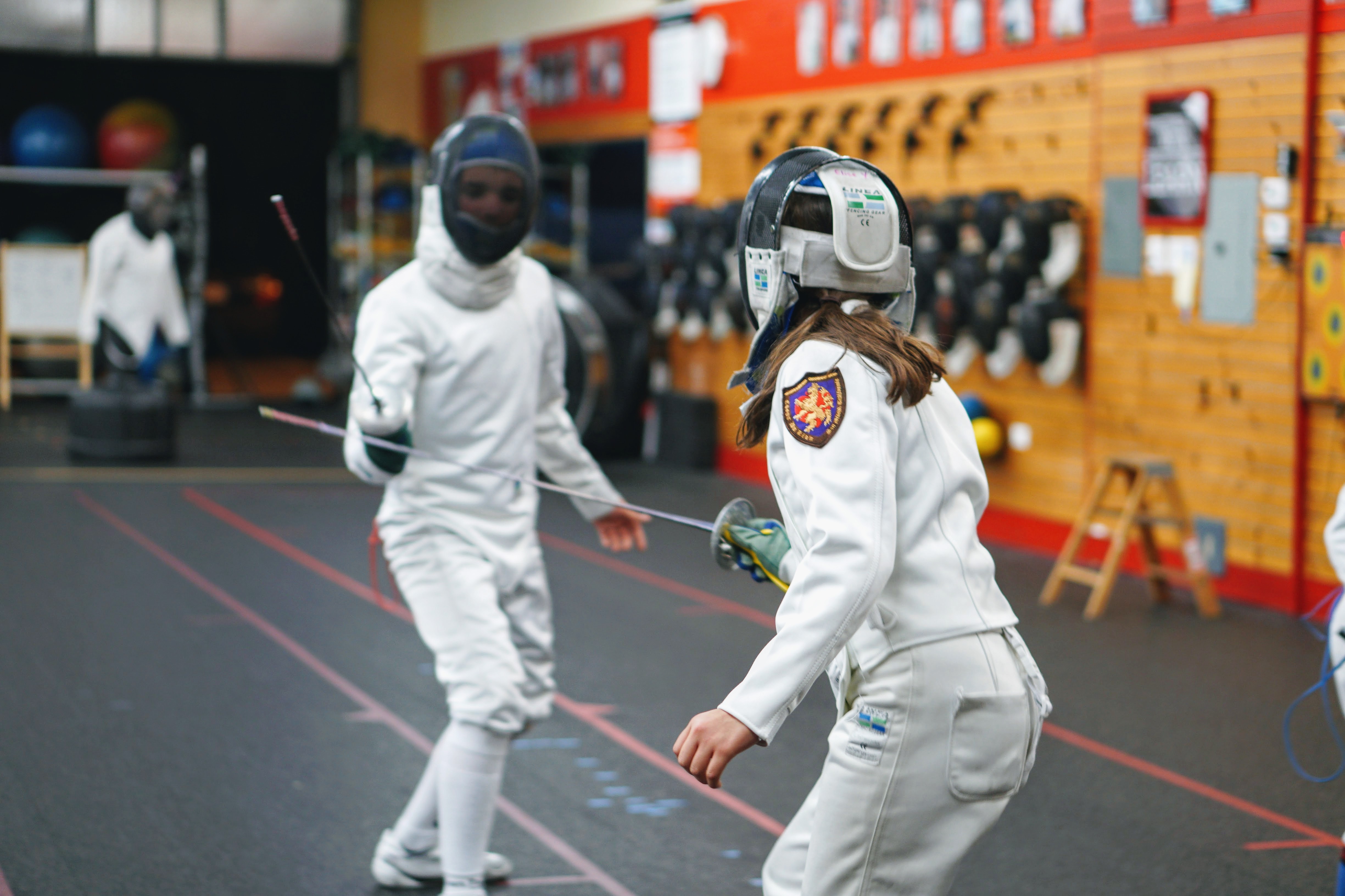 two fencers practicing fencing